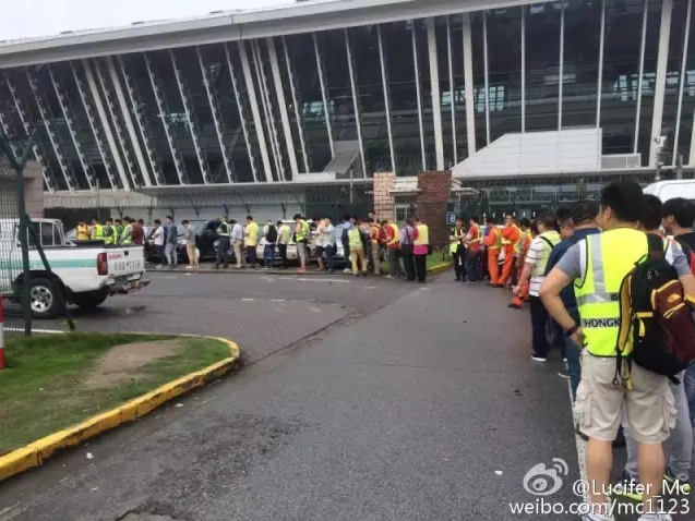 Line snakes outside of Pudong Airport following airport explosion