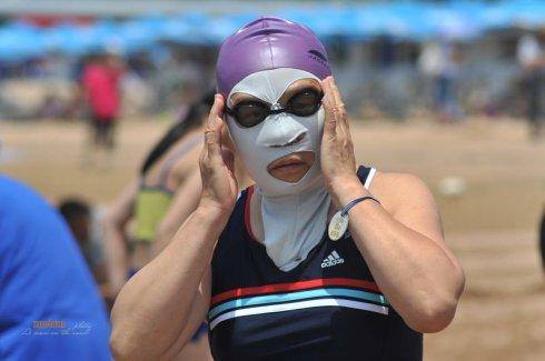 Facekini back in season as Qingdao residents flock to the beach