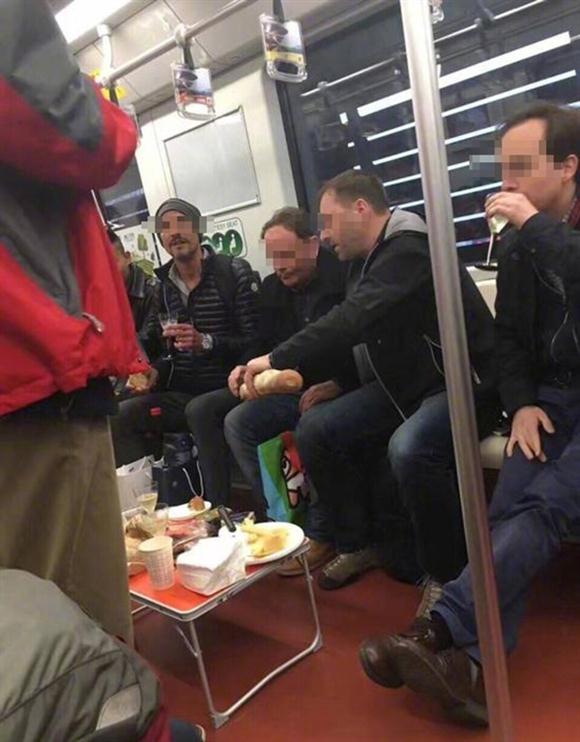 Foreigners picnic on metro