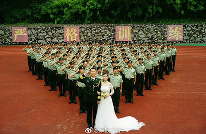 Couple-Take-Wedding-Photos-Surrounded-by-Graduating-Border-Police-1.jpg