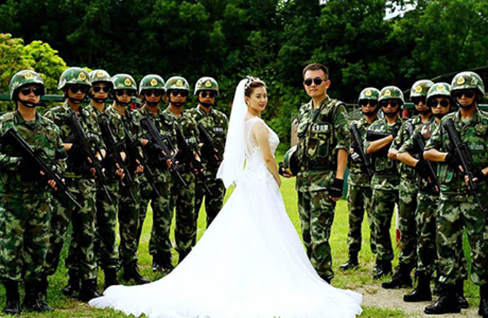Couple-Take-Wedding-Photos-Surrounded-by-Graduating-Border-Police-4.jpg