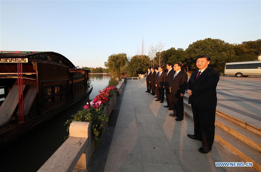 Xi Jinping and crew by the boat