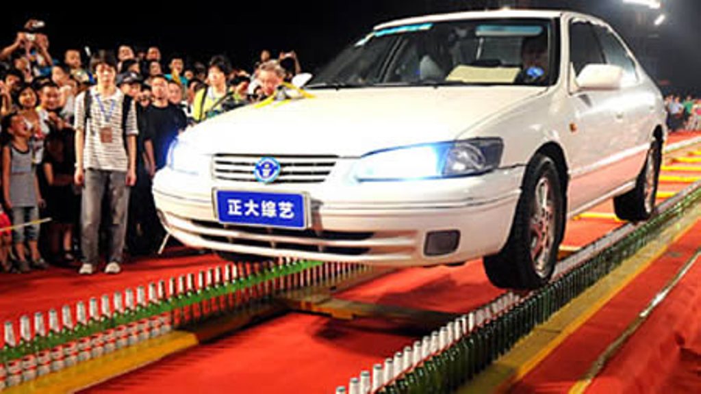 Longest distance driving on glass bottles: 197 feet, 5.68 inches (2010)