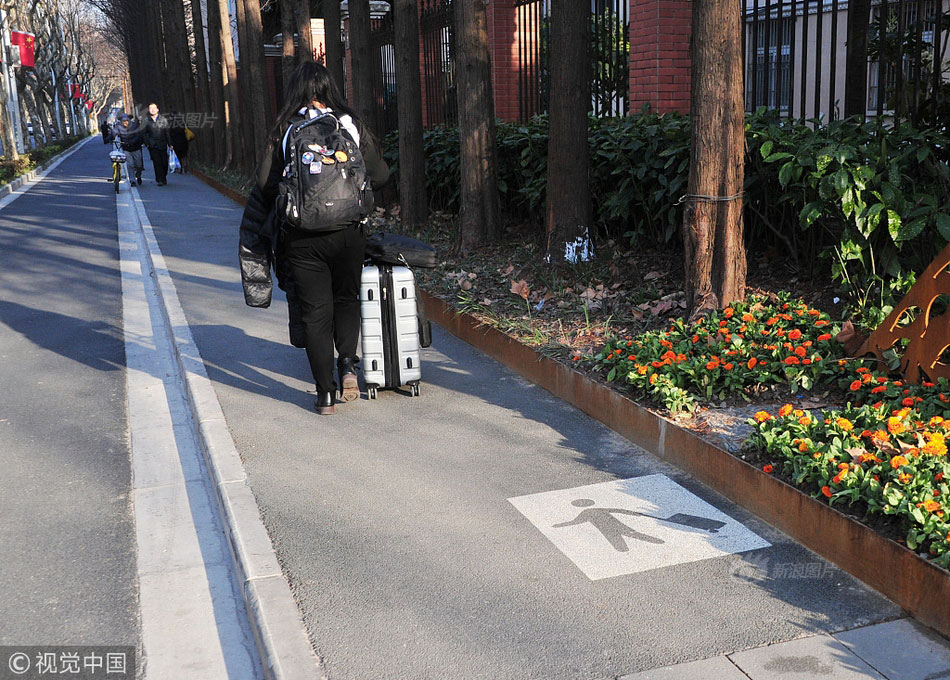 Shanghai Debuts 'Wheeled Suitcase Only' Sidewalks