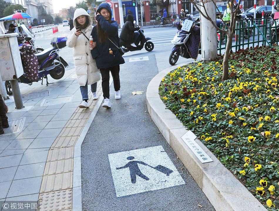 Shanghai Introduces 'Wheeled Suitcase Only' Sidewalks