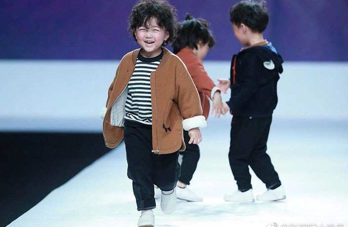 WATCH: Adorable Kid Models Tumble on the Runway at Shanghai Fashion Week