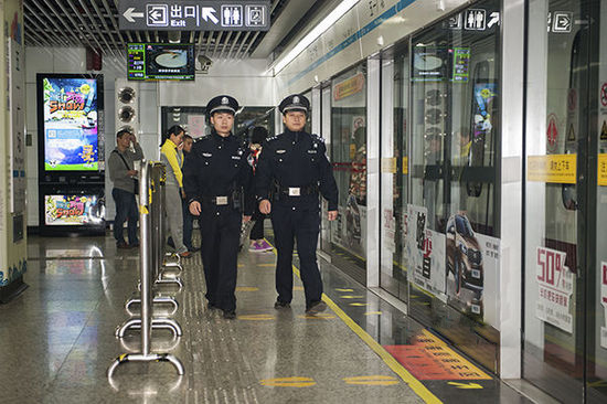 Cops-patrol-a-metro-station-in-Changsha..jpg