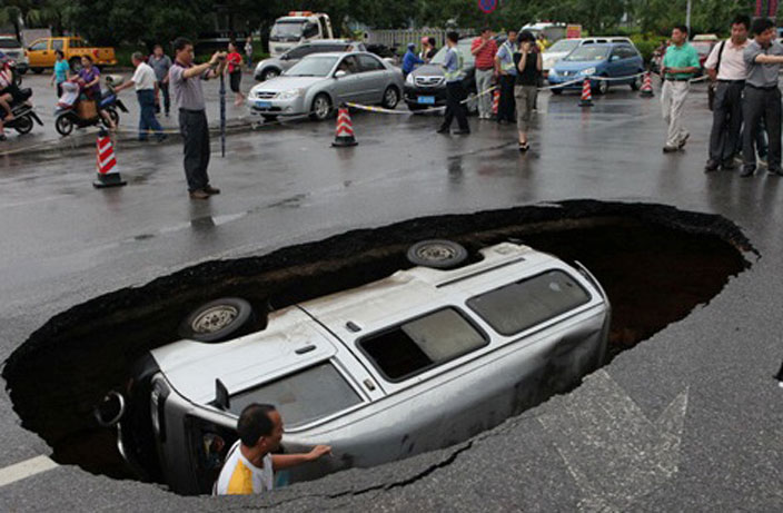 15 Photos of China's Sinkhole Epidemic That Will Terrify You
