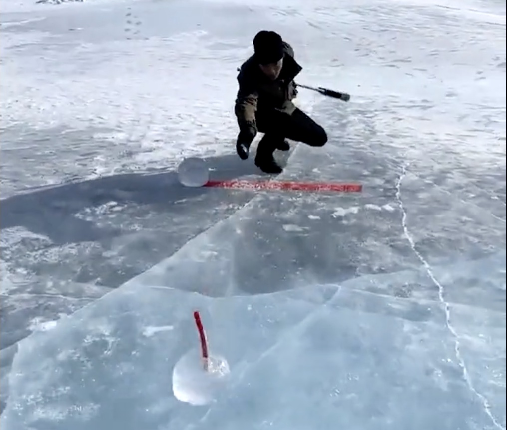 WATCH: Man Makes Curling Rink on Frozen Lake
