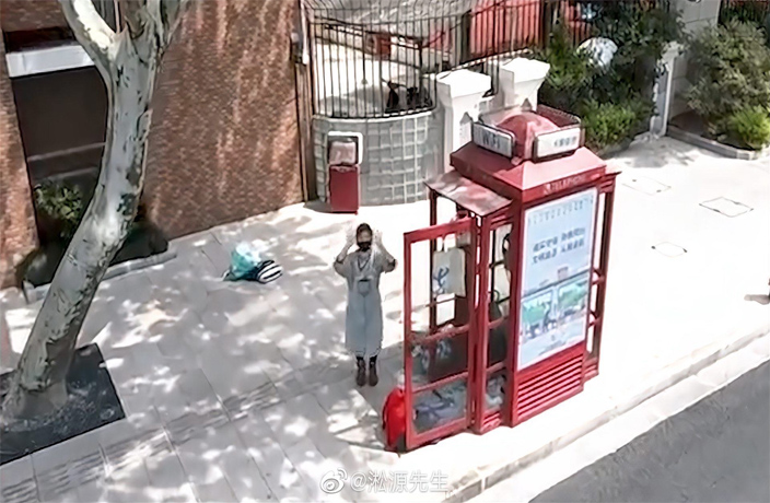 Phone Booth Quarantine Emblematic of Migrant Workers’ Conditions