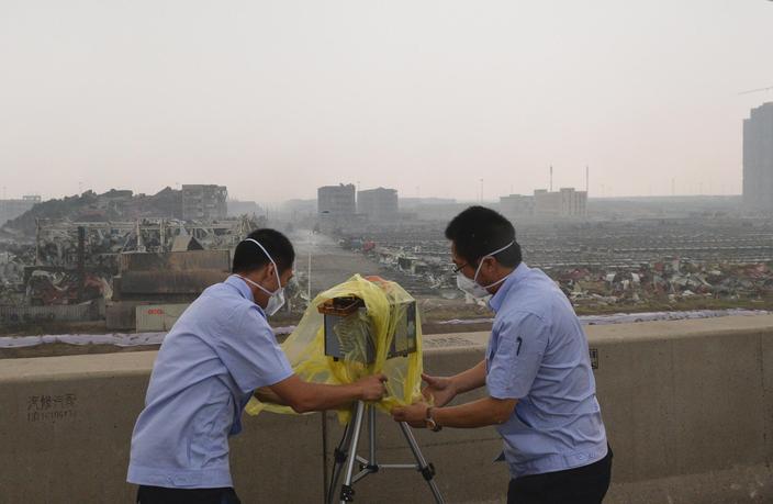 Tianjin authorities monitor the air after deadly chemical explosions