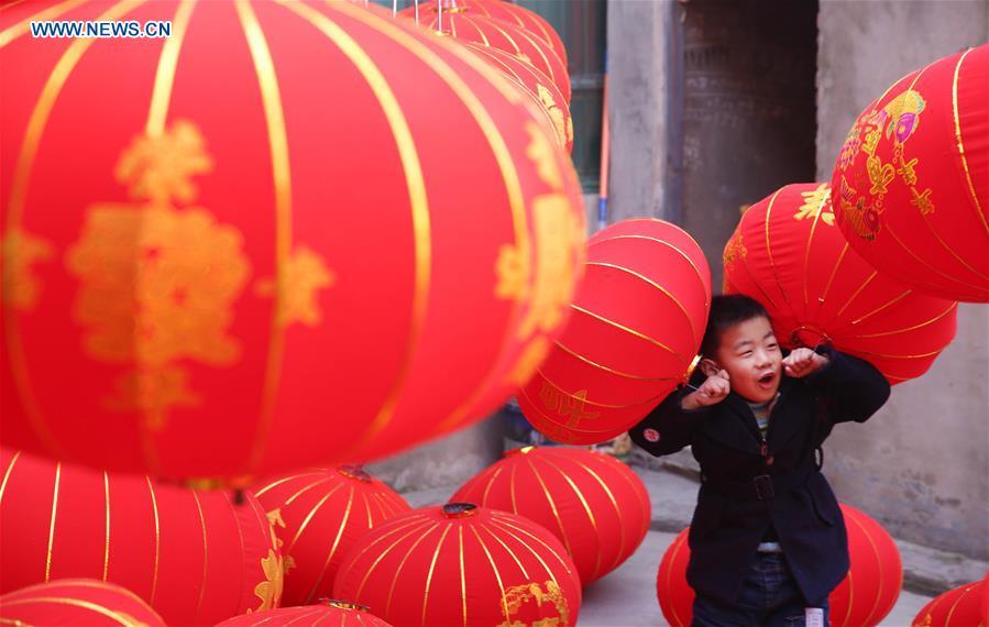 Local villagers hang New Years Lanterns in Wuzhi County, Henan Province