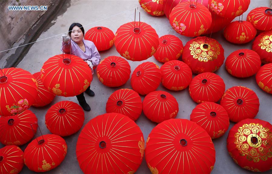 Local villagers hang New Years Lanterns in Wuzhi County, Henan Province