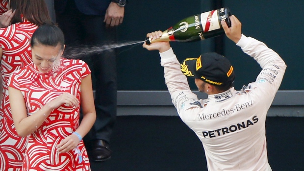 Lewis Hamilton Sprays Champagne After Winning the F1