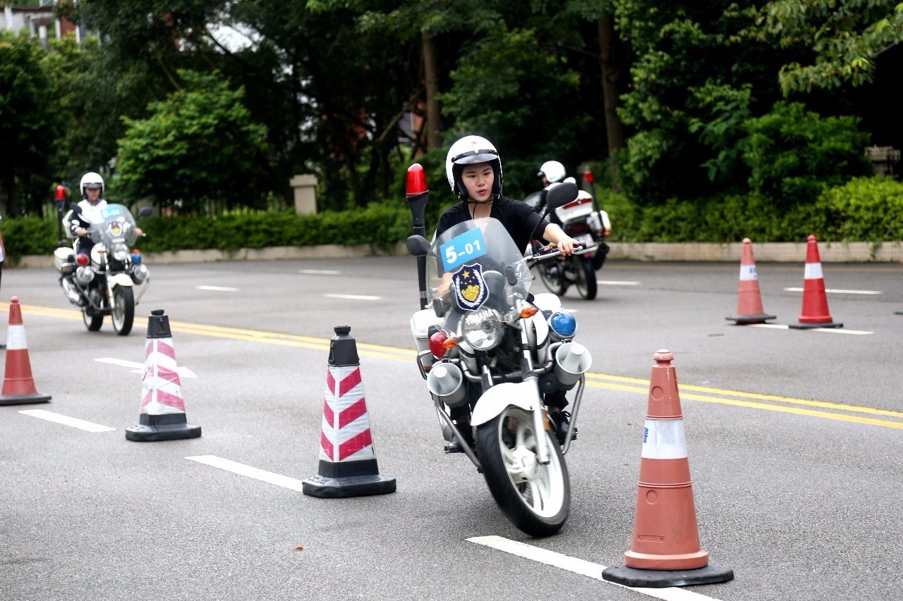female traffic motorcycle police exercise cones