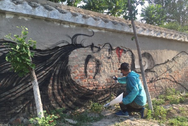 woman banksy qi xinghua