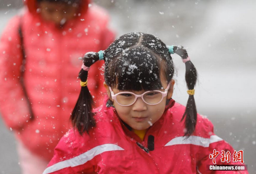 PHOTOS: Beijing Sees First Snow of the Season