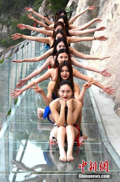 PHOTOS: Bikini Clad Models Pose on Vertical Cliff in Henan
