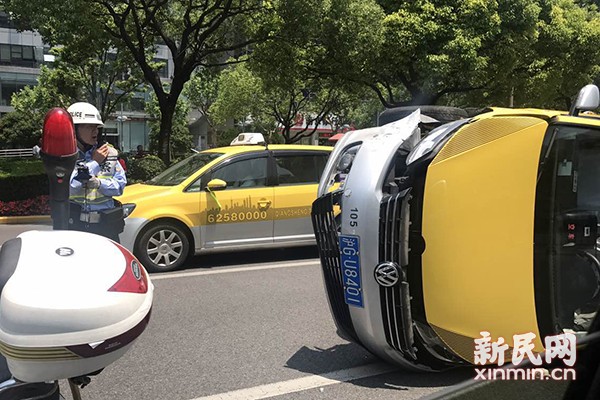 Taxi overturned Century Avenue