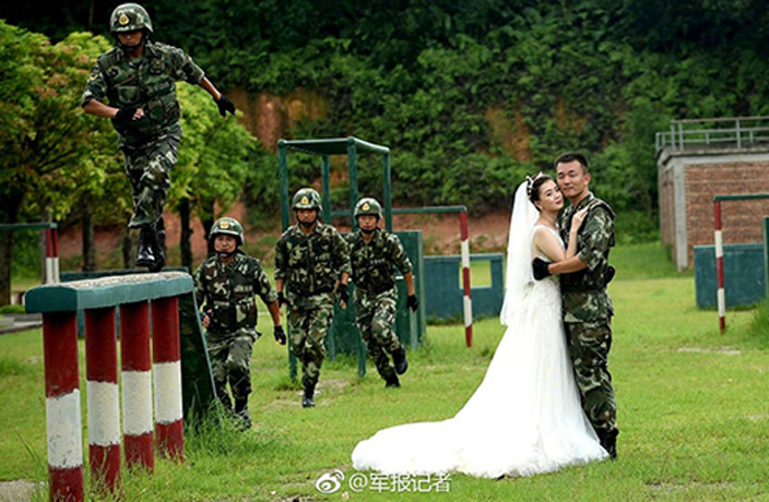 Couple-Take-Wedding-Photos-Surrounded-by-Graduating-Border-Police-5.jpg