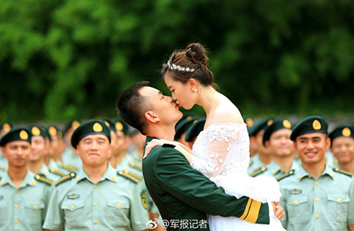 Couple-Take-Wedding-Photos-Surrounded-by-Graduating-Border-Police-6.jpg
