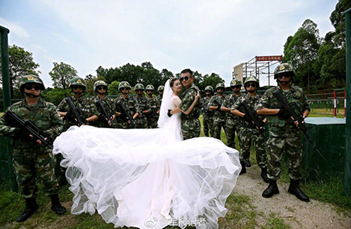 Couple-Take-Wedding-Photos-Surrounded-by-Graduating-Border-Police-9.jpg