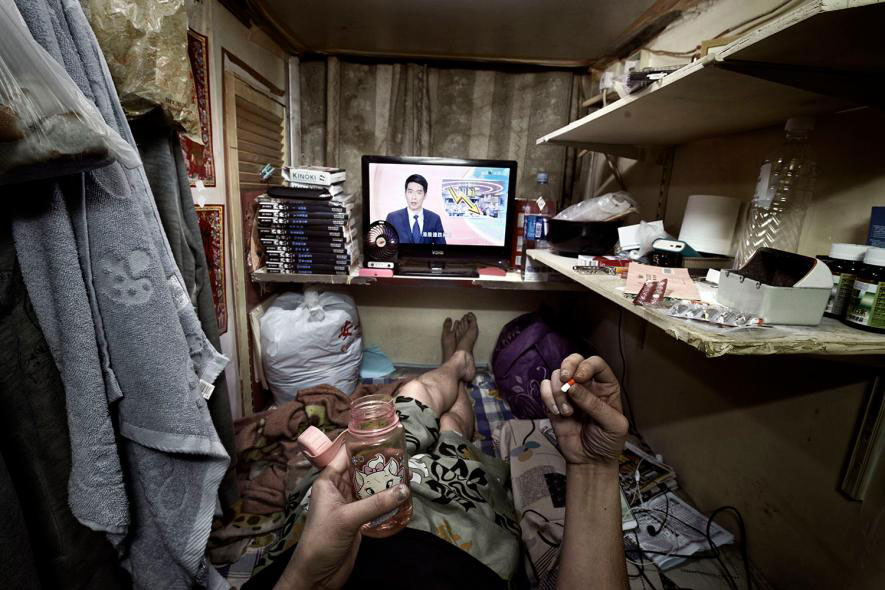 PHOTOS Inside Hong Kong s Coffin Sized Apartments 