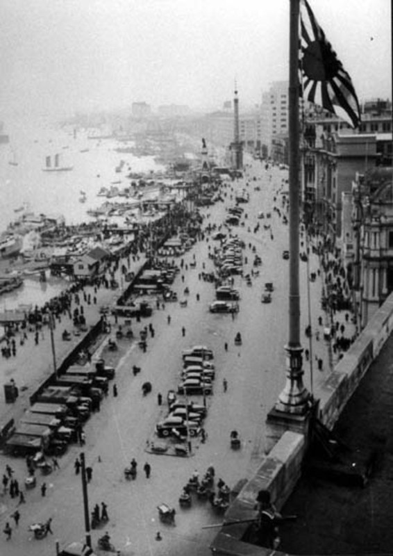 A Japanese sailor looks down on the occupied Bund shortly after the takeover