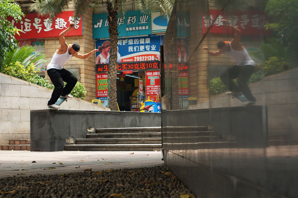 4-Skater-grinds-a-ledge-plaza-in-Foshan.jpg