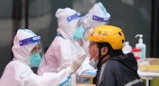 Police Bust Fake Nurses at Beijing COVID-19 Testing Site