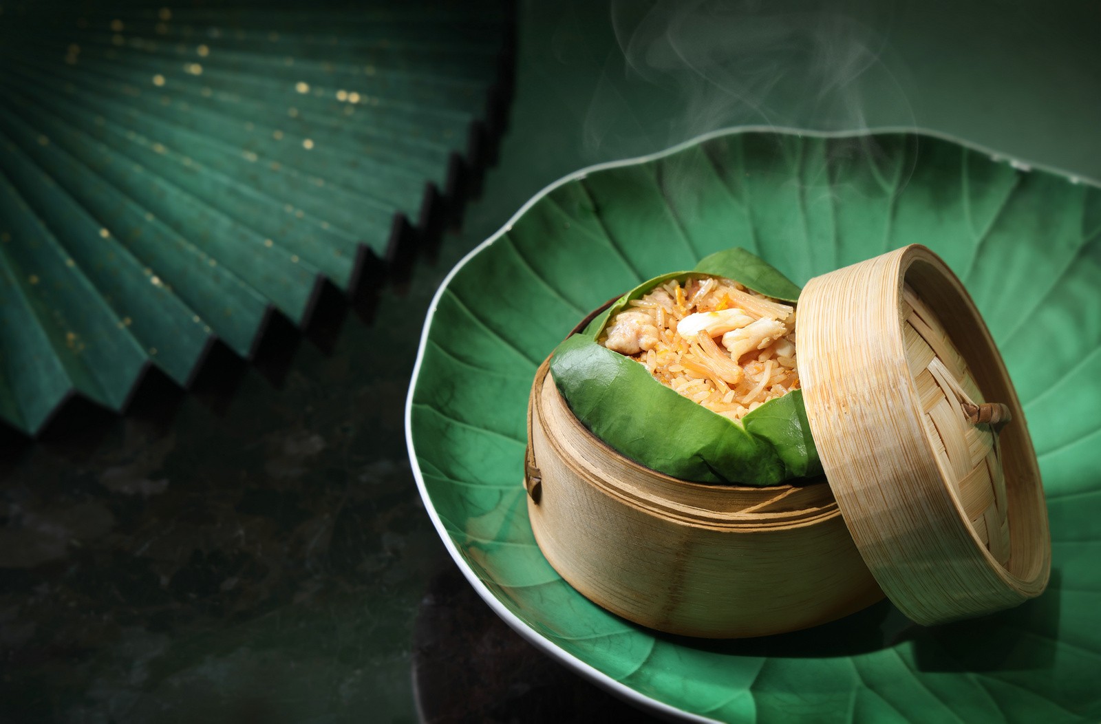 lai-ching-heen_fried-rice-wrapped-and-steamed-in-a-lotus-leaf_landscape_52831122292_o.jpg