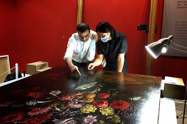 Restoring a painting puntured by a 12-year-old boy in Taiwan